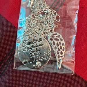 Women’s necklace with wings and pendant